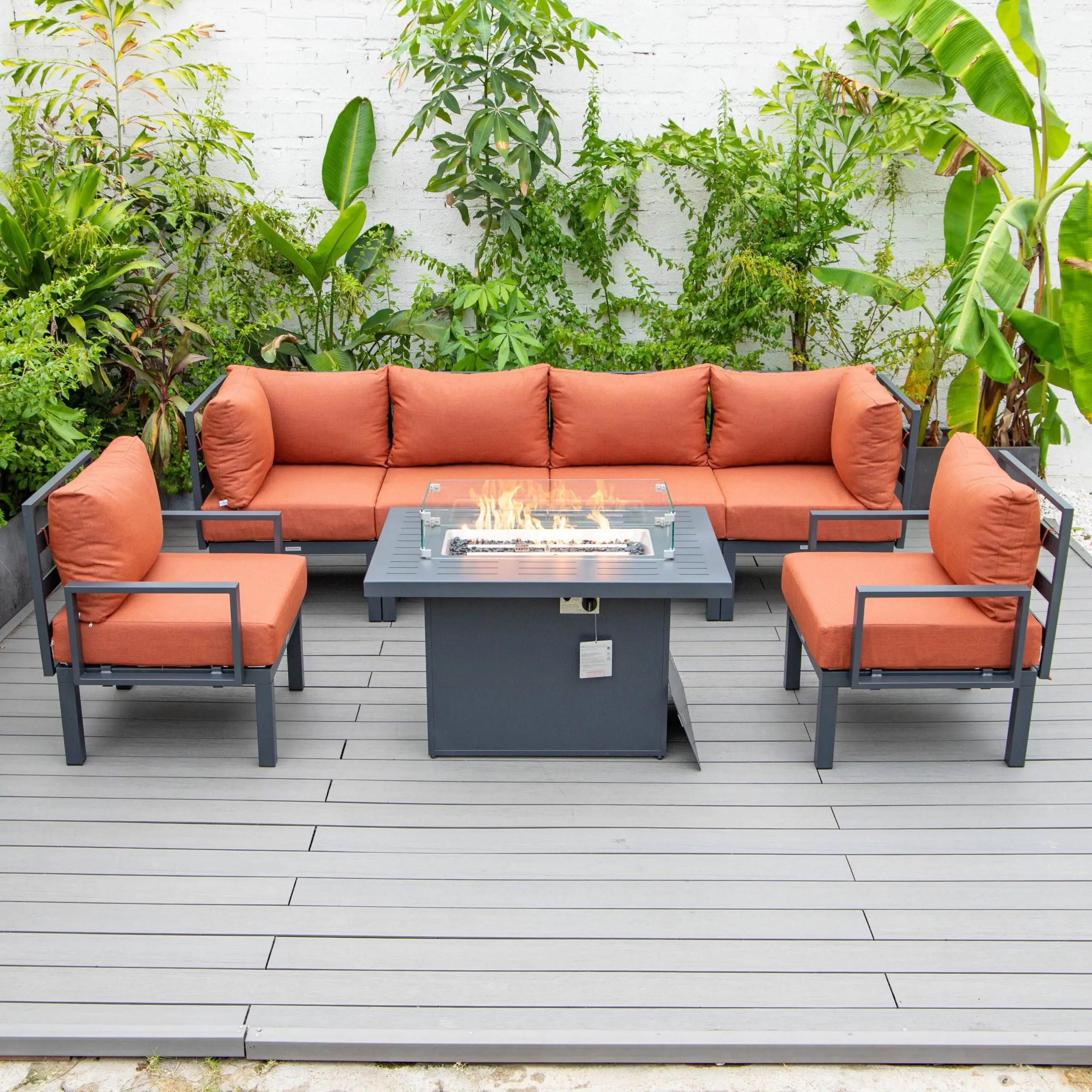 LeisureMod Chelsea 7-Piece Sectional And Fire Pit Table With Cushions in Orange